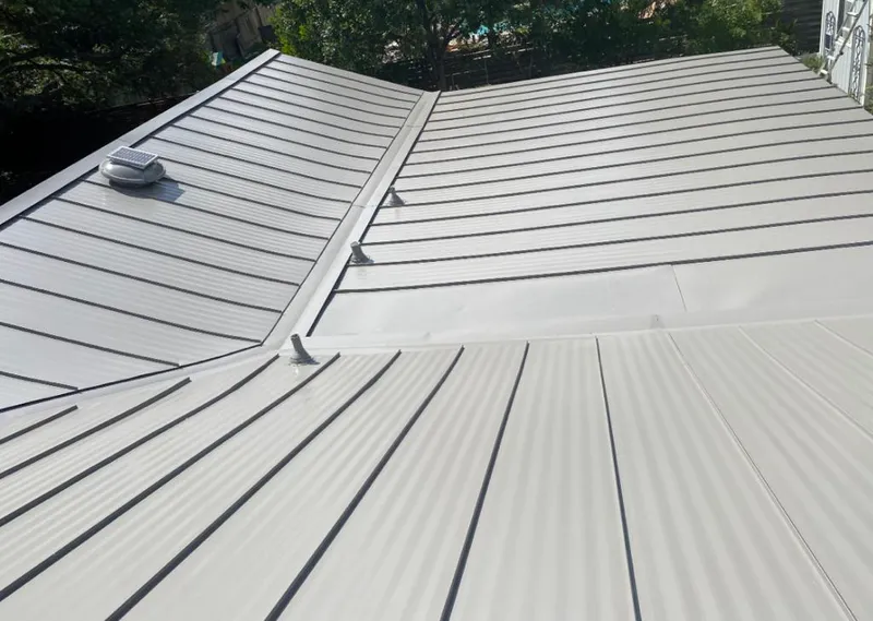 Solar attic fan installed on a metal roof for Roof Ventilation in Vancouver